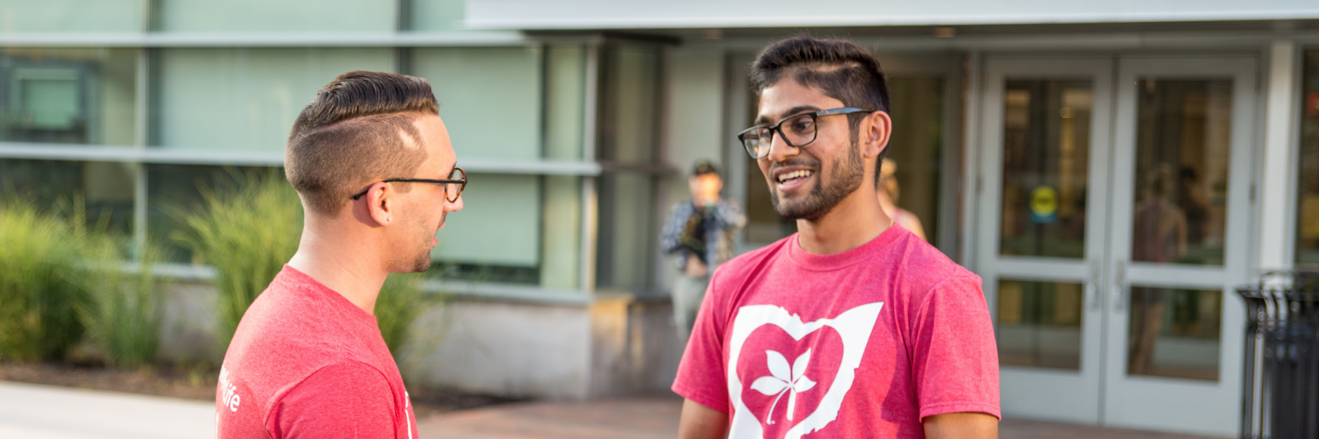 two students talking outside Drackett Tower